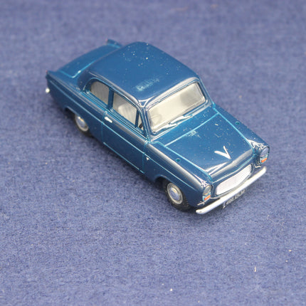 Model of a blue vintage car on a textured blue surface