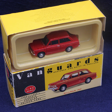 Red model car in a 'Vanguards' box on a blue background
