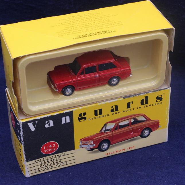 Red model car in a 'Vanguards' box on a blue background