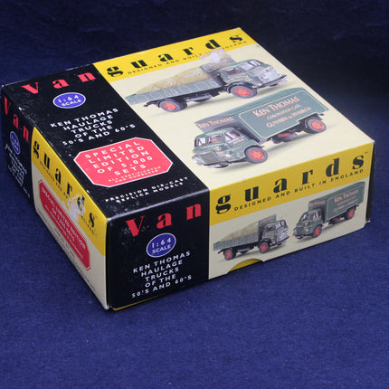 Box of Vanguards model trucks on a blue background