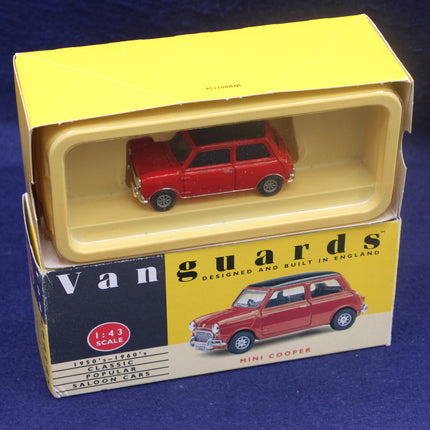 Red model car in a 'Vanguards' box on a blue background