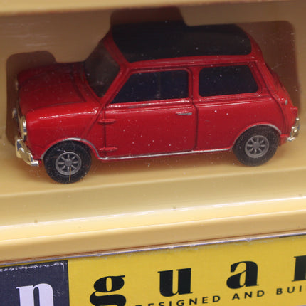 Red toy car on a yellow surface with 'n guard' branding.