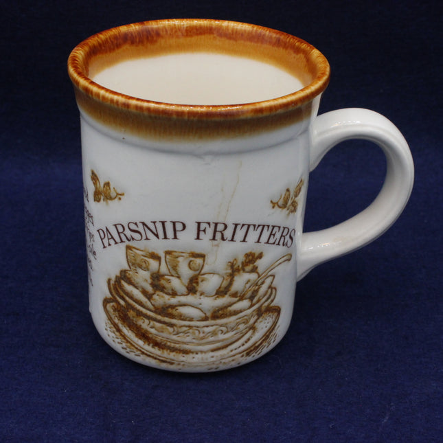White mug with brown parsnip fritters text and graphics on a blue background