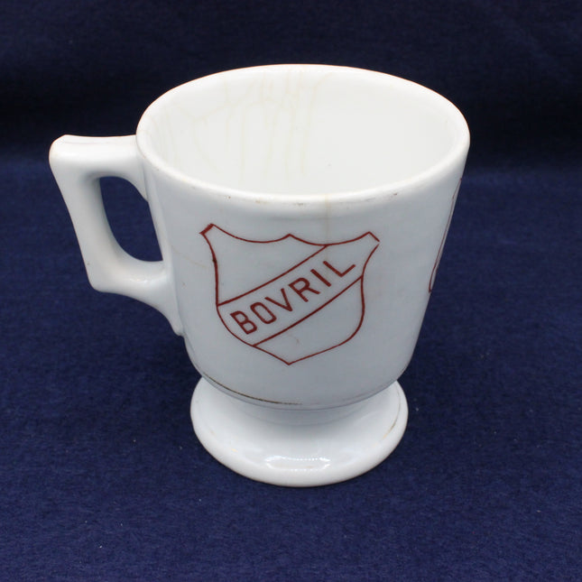 White mug with Bovril logo on a dark blue background