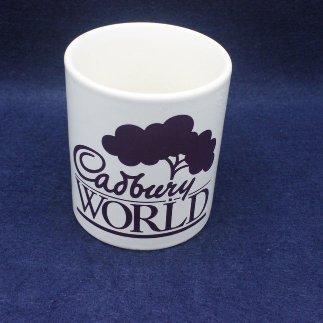 White mug with 'Cadbury World' text on a blue background