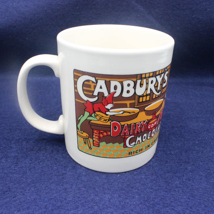 White mug with Cadbury Dairy Milk Chocolate branding on a blue background