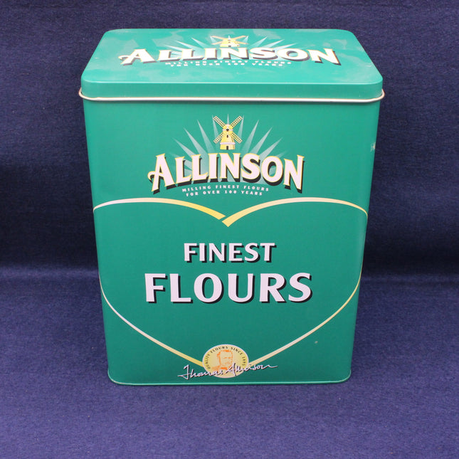 Green tin box of Allinson Finest Flours on a dark blue background
