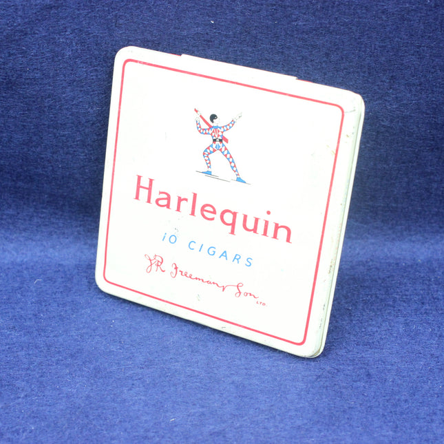 Harlequin brand cigar tin on a blue background