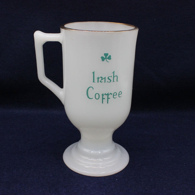 White mug with 'Irish Coffee' text and shamrock on a dark background