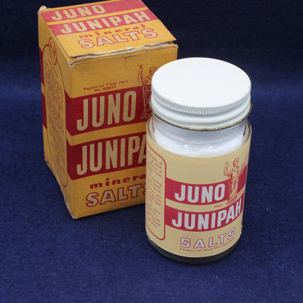 Juno Junipah mineral salts container and packaging on a blue background
