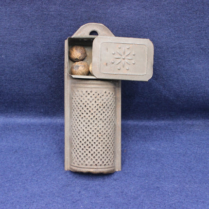 Decorative stone holder with textured surface on a blue background