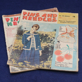 Vintage 'Pins and Needles' magazine with a woman in a blue dress on the cover, displayed on a blue background.