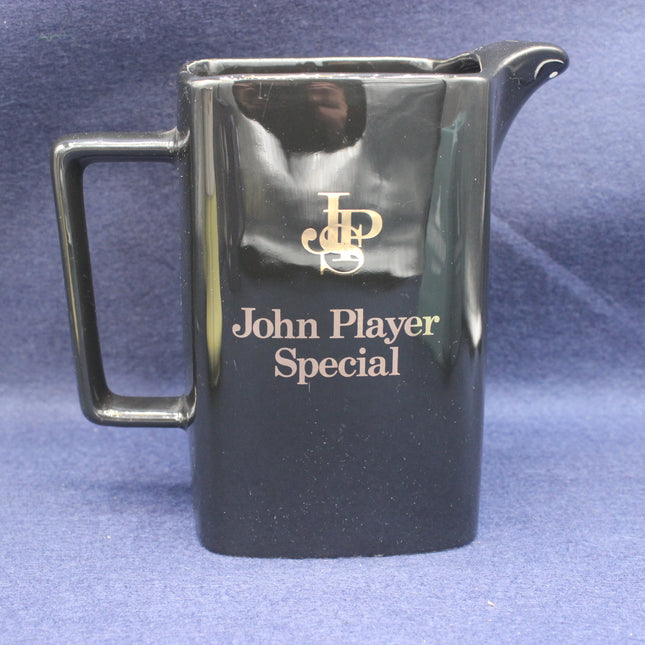 Black pitcher with 'John Player Special' branding on a blue background