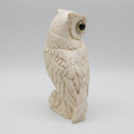 Rear view of the alabaster owl ornament showing carved plumage across the back and wings.