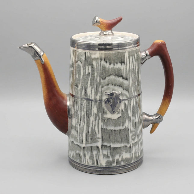 Teapot with wooden handle and lid knob on a blue background