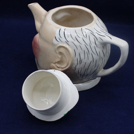 Character Devonmoor tea pot on a dark blue background