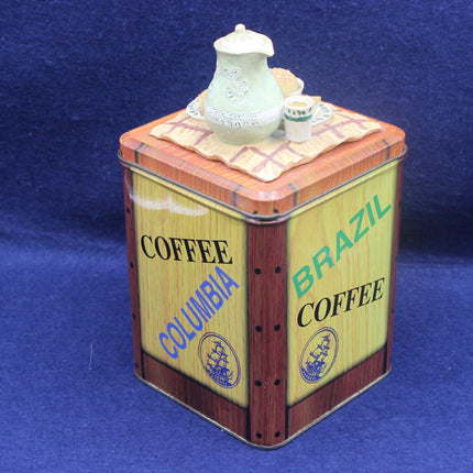 Vintage-style coffee canister with 'Coffee Columbia' and 'Brazil Coffee' text on a blue background