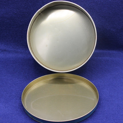 Two metallic trays on a blue background