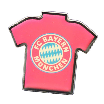 Pin shaped like a red FC Bayern Munich jersey on a blue textured background