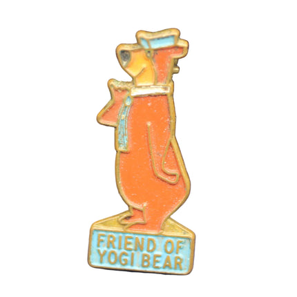 Pin with cartoon bear character on a blue background