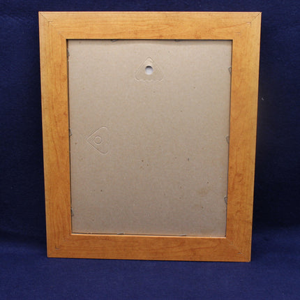 Wooden picture frame on a blue background
