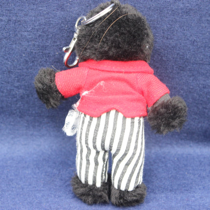 Vintage Golly Keyring on a dark blue background