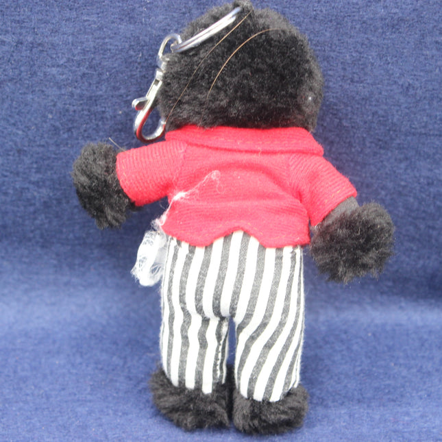 Vintage Golly Keyring on a dark blue background