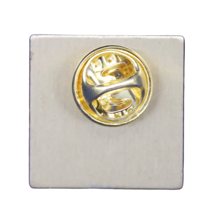 Gold and silver badge on a blue velvet background
