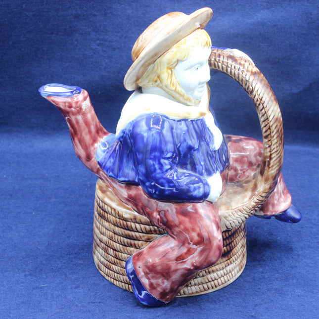 Vintage Majolica Manxman Style Sailor Teapot on a blue background