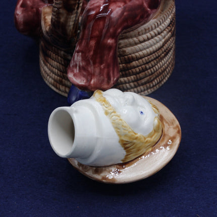 Ceramic vase with sailor design on a blue background