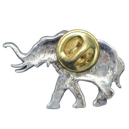 Silver elephant pin with a gold coin on a blue background