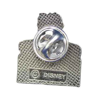 Metallic Disney pin on a blue textured background