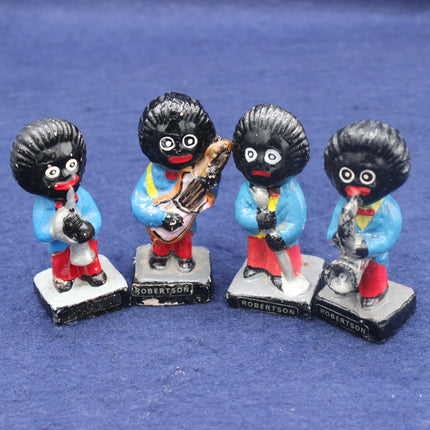 Four golliy figurines on a blue background