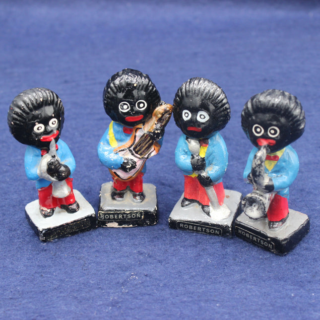 Four golliy figurines on a blue background