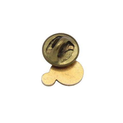 A small gold-colored metal pin or badge with a round top and a flat teardrop-shaped backing, shown on a plain light gray background.