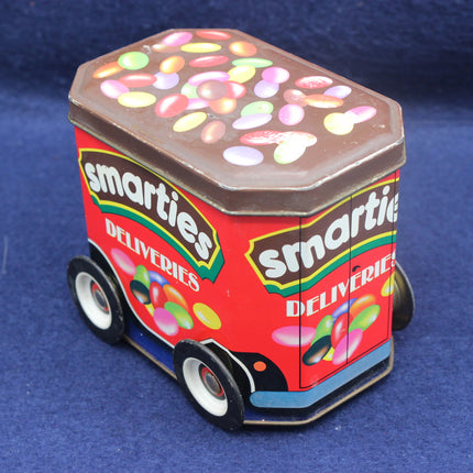 Smarties candy delivery truck toy on a blue background
