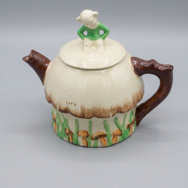 Vintage Suvesco crackle‑glaze mushroom cottage teapot with hand‑painted detail and whimsical charm. Classic British novelty pottery with strong collector appeal.