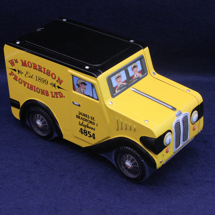Yellow van model tin with Morrison branding on a dark blue background