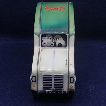 Model of a van with cartoon characters on the windshield against a dark background