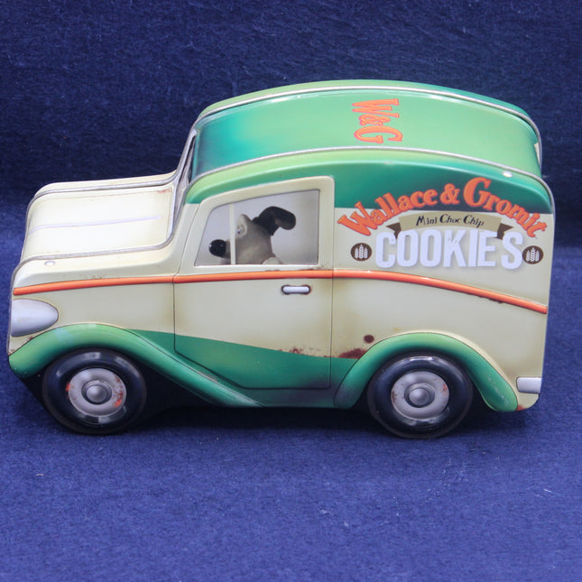 Toy truck resembling a vintage delivery van with 'Wallace & Gromit' branding on a blue background.