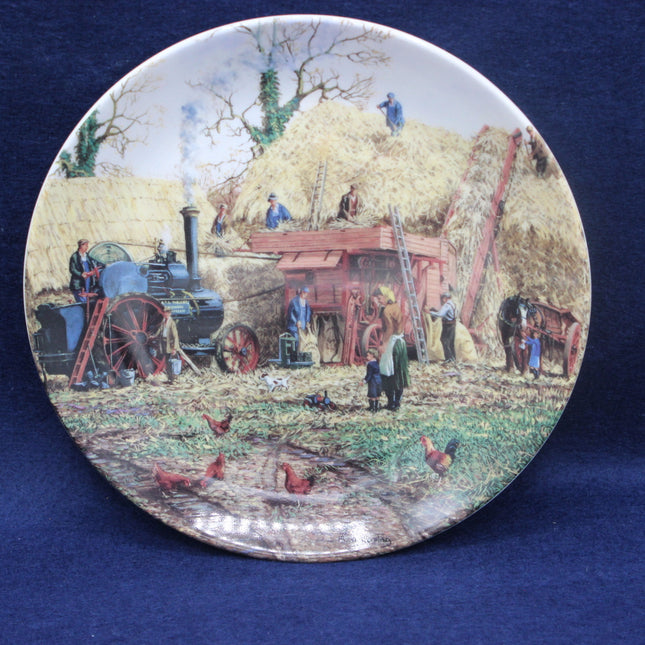 Decorative plate with a rural scene featuring people and animals on a blue background