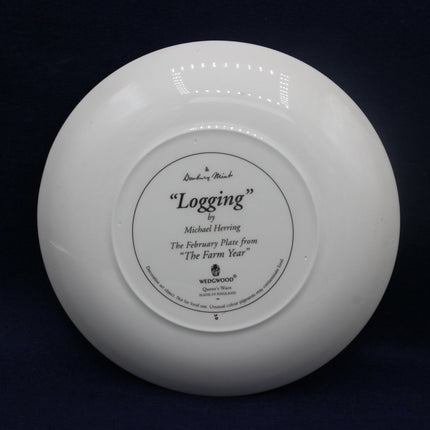 White plate with engraved text on a black background