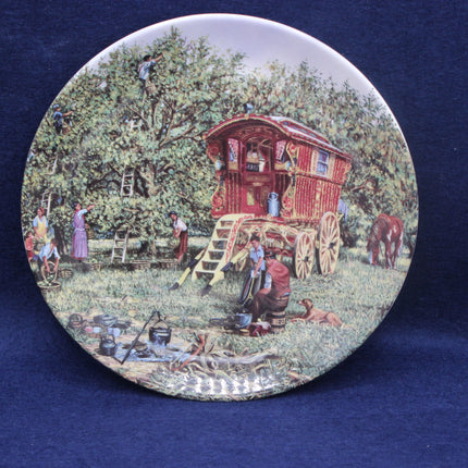 Decorative plate with a gypsy caravan scene on a blue background