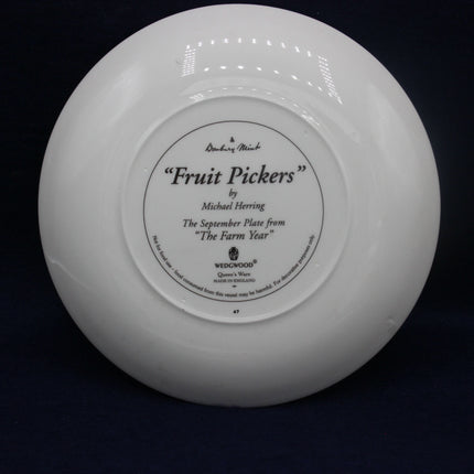 Widowood plate with 'Fruit Pickers' label on a black background