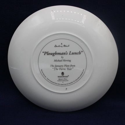 White plate with 'Ploughman's Lunch' text on a dark background