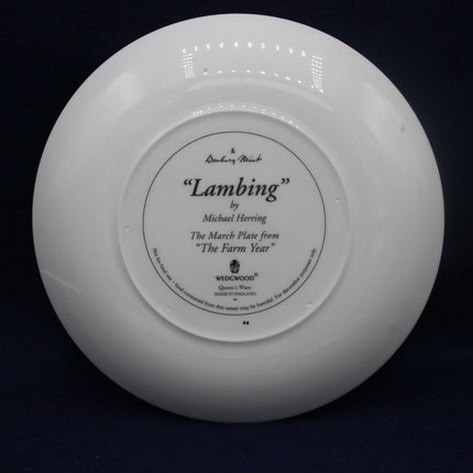 White plate with 'Lambing' by Michael Herring branding on a black background