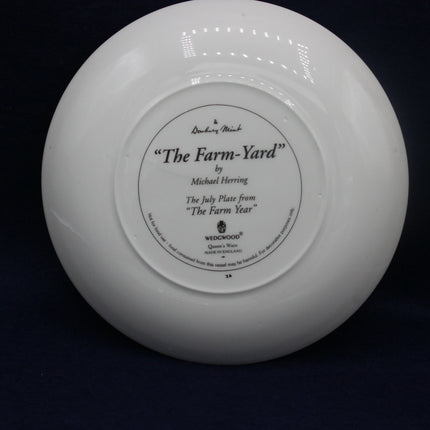 White ceramic plate with 'The Farm-Yard' by Michael Herring branding on a black background