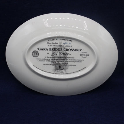 White plate with text and branding on a dark background
