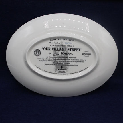 White plate with text and branding on a dark background