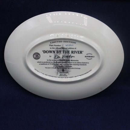 White plate with text and branding on a dark background